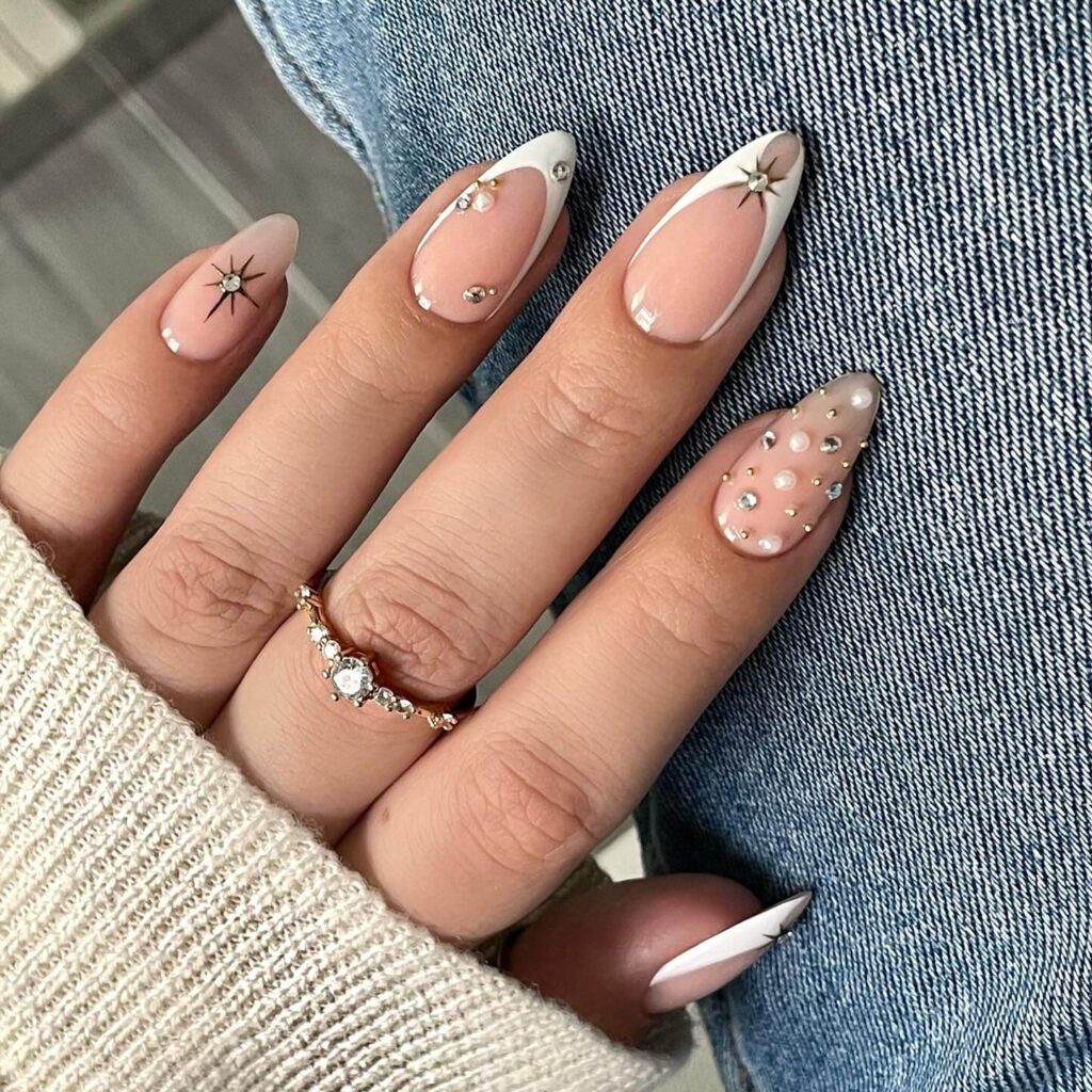 Chic almond nails with a subtle ombre design, combining pastel tones for a classic and modern look