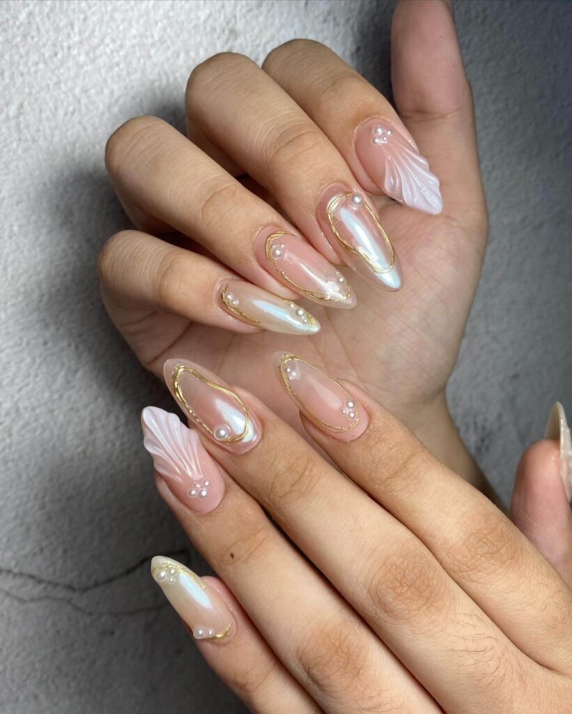 Chic almond nails with a subtle ombre design, combining pastel tones for a classic and modern look