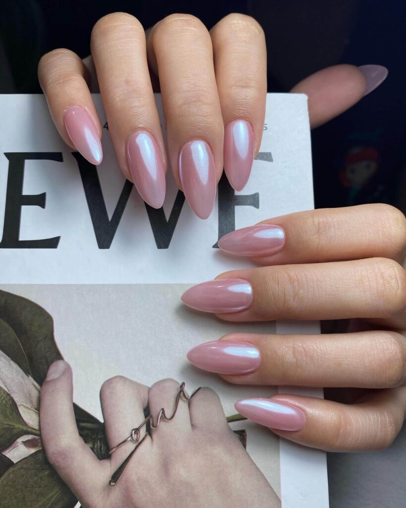 Chic almond nails with a subtle ombre design, combining pastel tones for a classic and modern look