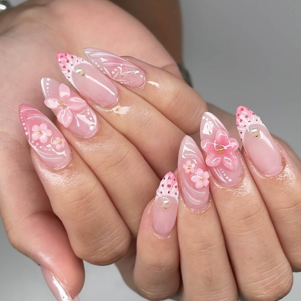 Chic almond nails with a subtle ombre design, combining pastel tones for a classic and modern look