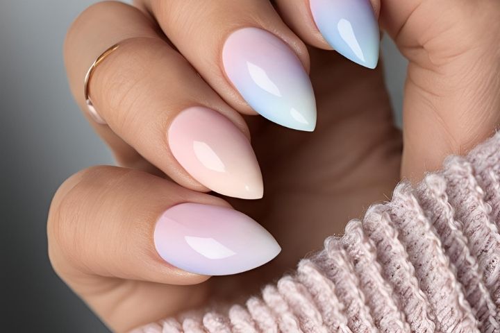 Chic almond nails with a subtle ombre design, combining pastel tones for a classic and modern look