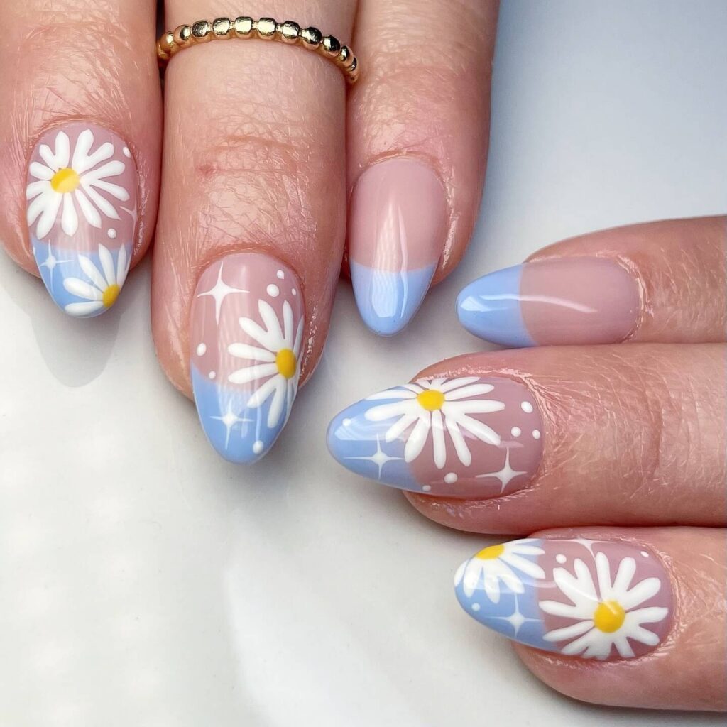 Flower nails with delicate daisy designs, perfect for a fresh spring manicure