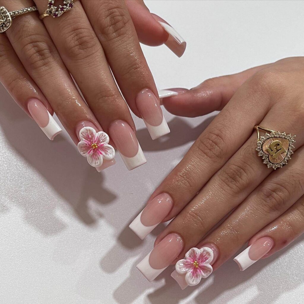 Flower nails with delicate daisy designs, perfect for a fresh spring manicure