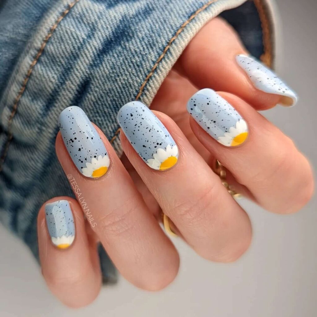 Flower nails with delicate daisy designs, perfect for a fresh spring manicure