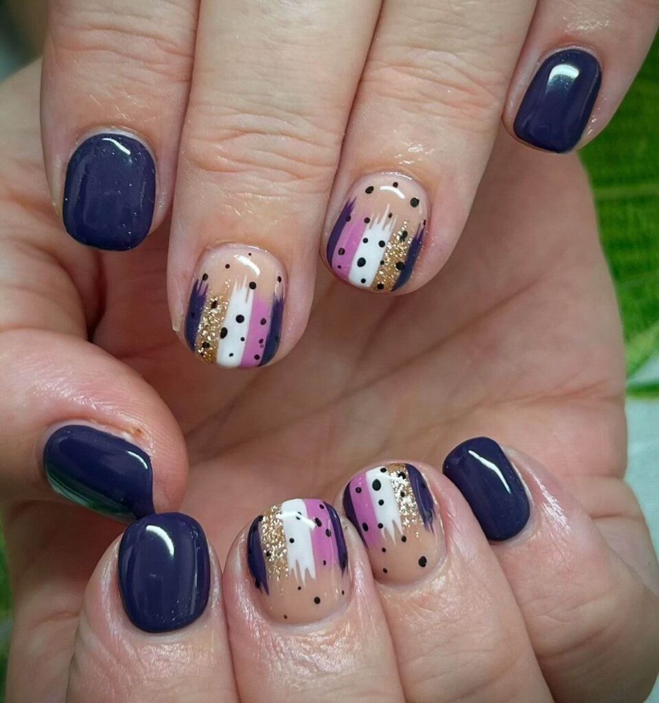 Abstract nail art with vibrant geometric designs and bold color patterns, perfect for creative manicures