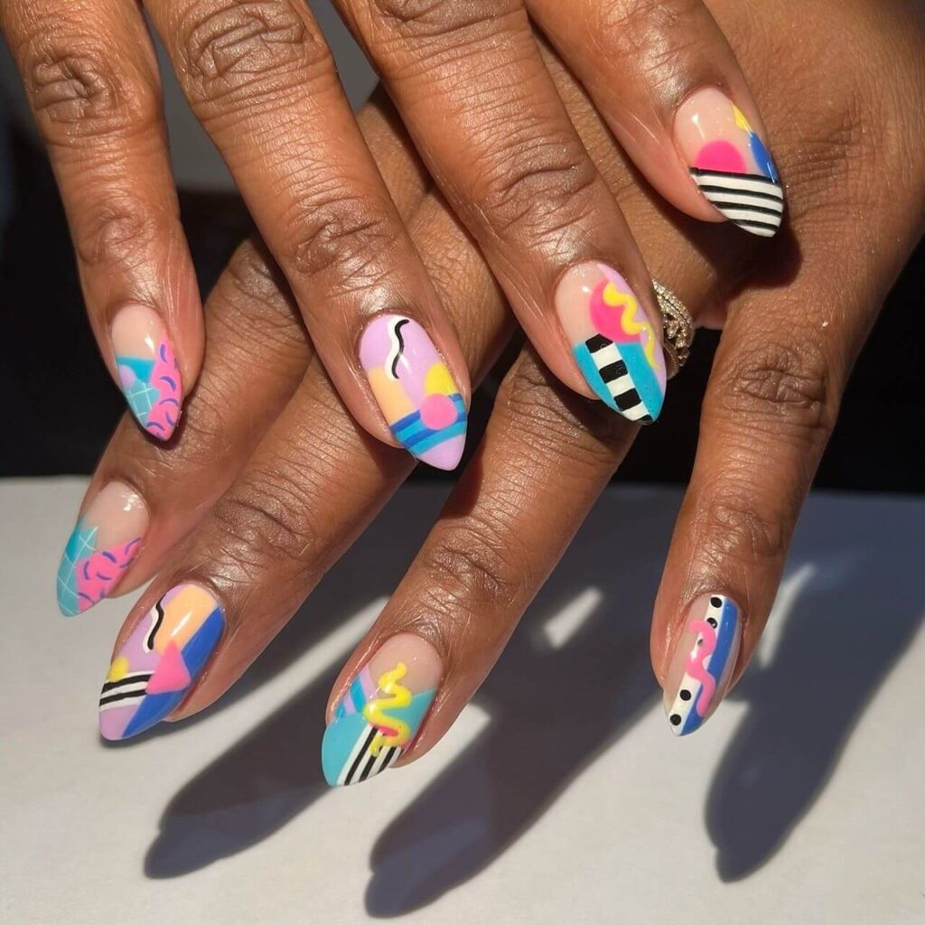 Abstract nail art with vibrant geometric designs and bold color patterns, perfect for creative manicures