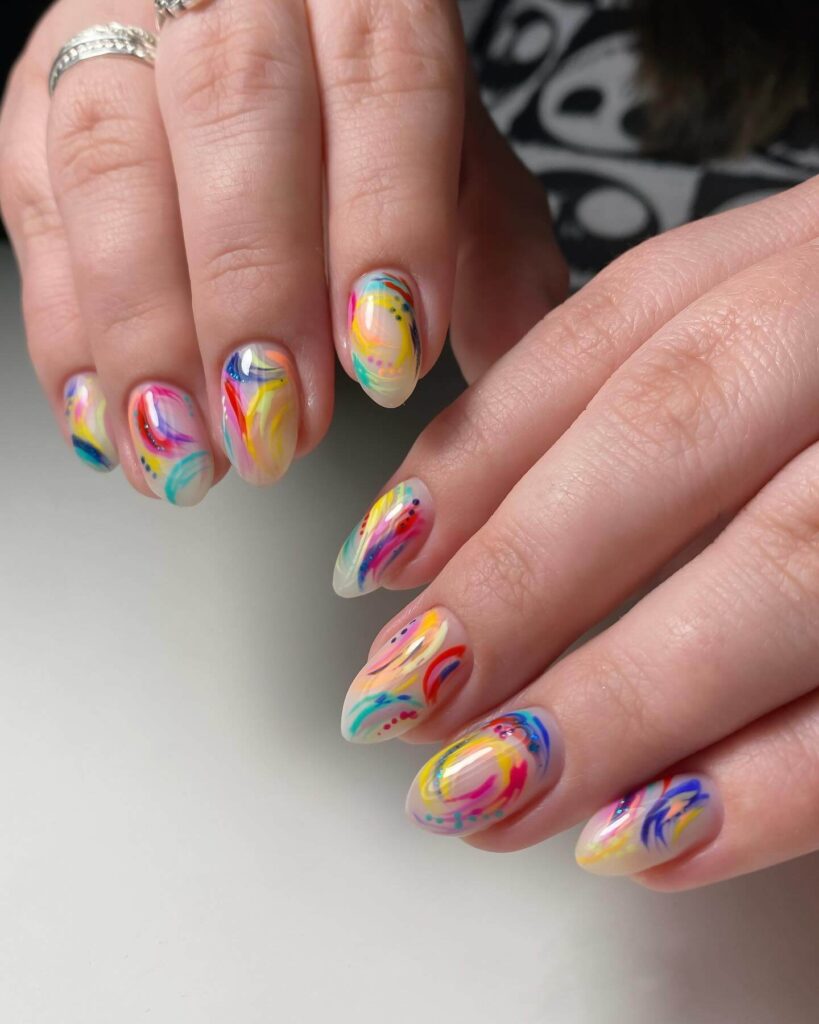 Abstract nail art with vibrant geometric designs and bold color patterns, perfect for creative manicures