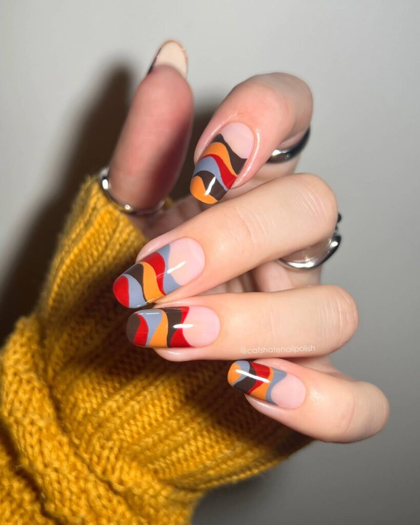 Abstract nail art with vibrant geometric designs and bold color patterns, perfect for creative manicures