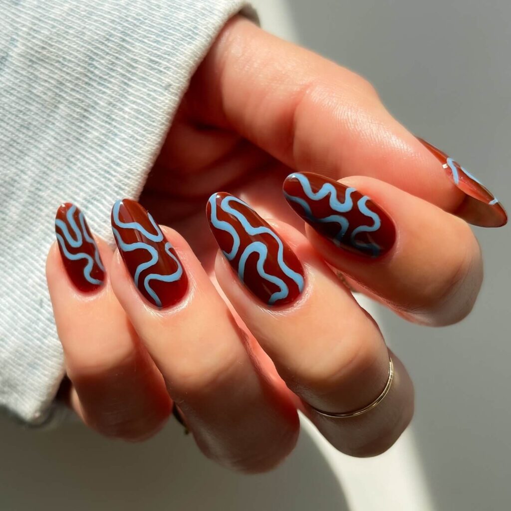 Abstract nail art with vibrant geometric designs and bold color patterns, perfect for creative manicures