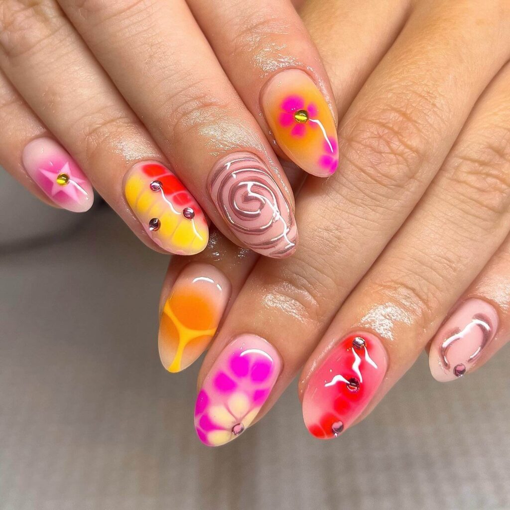 Abstract nail art with vibrant geometric designs and bold color patterns, perfect for creative manicures