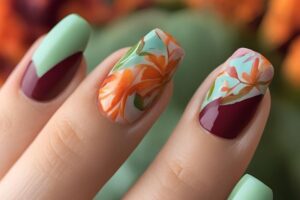 Bright and bold March nails showcasing orange, green, and burgundy tones perfect for the transition to spring