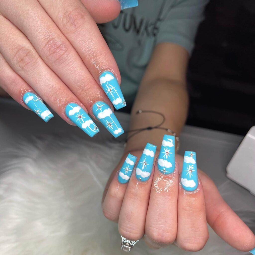 Stylish sky blue nails with a glossy finish, perfect for fresh and modern spring or holiday nail designs