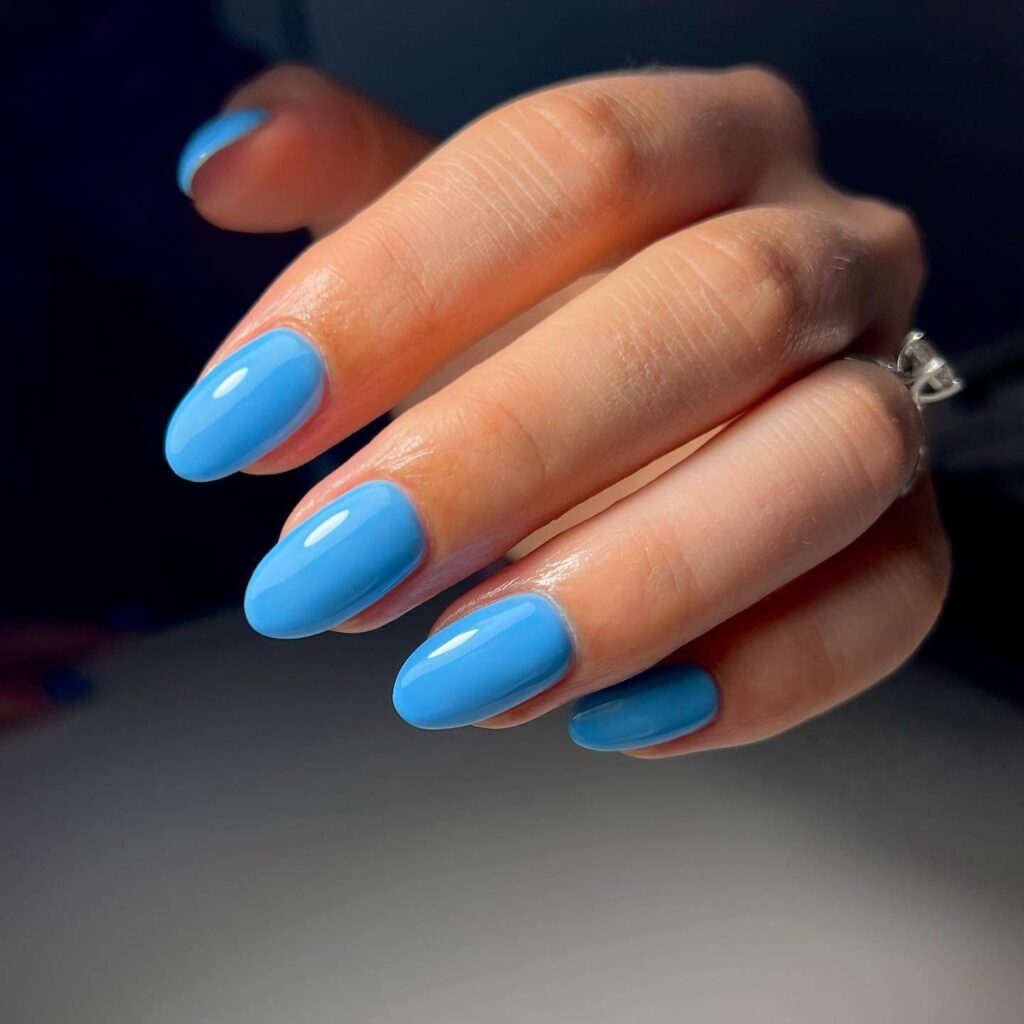 Stylish sky blue nails with a glossy finish, perfect for fresh and modern spring or holiday nail designs