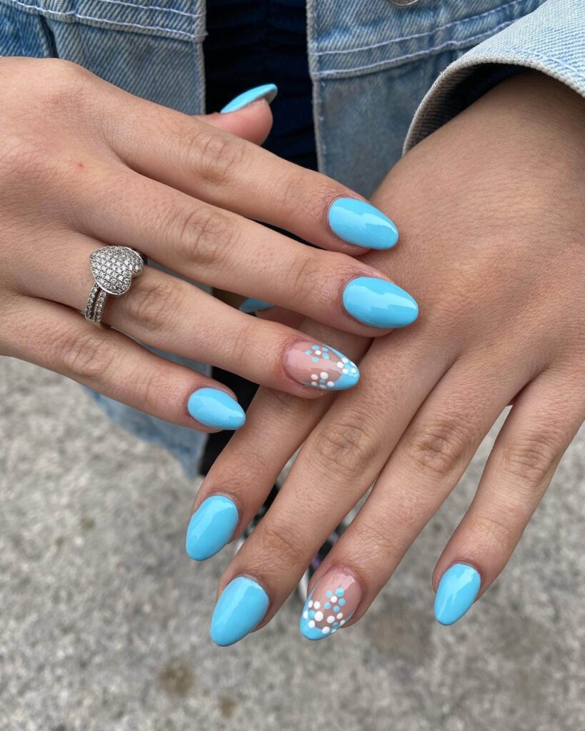 Stylish sky blue nails with a glossy finish, perfect for fresh and modern spring or holiday nail designs