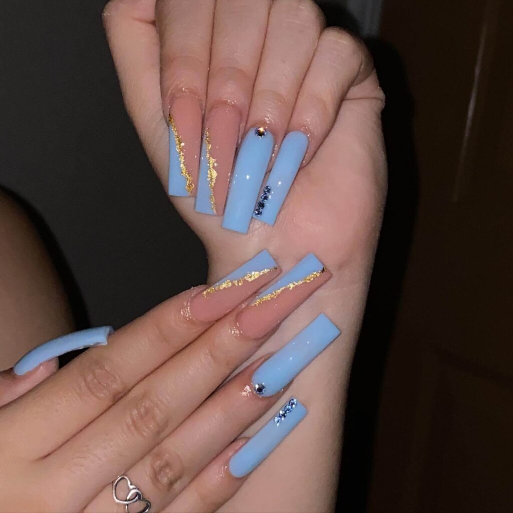 Stylish sky blue nails with a glossy finish, perfect for fresh and modern spring or holiday nail designs