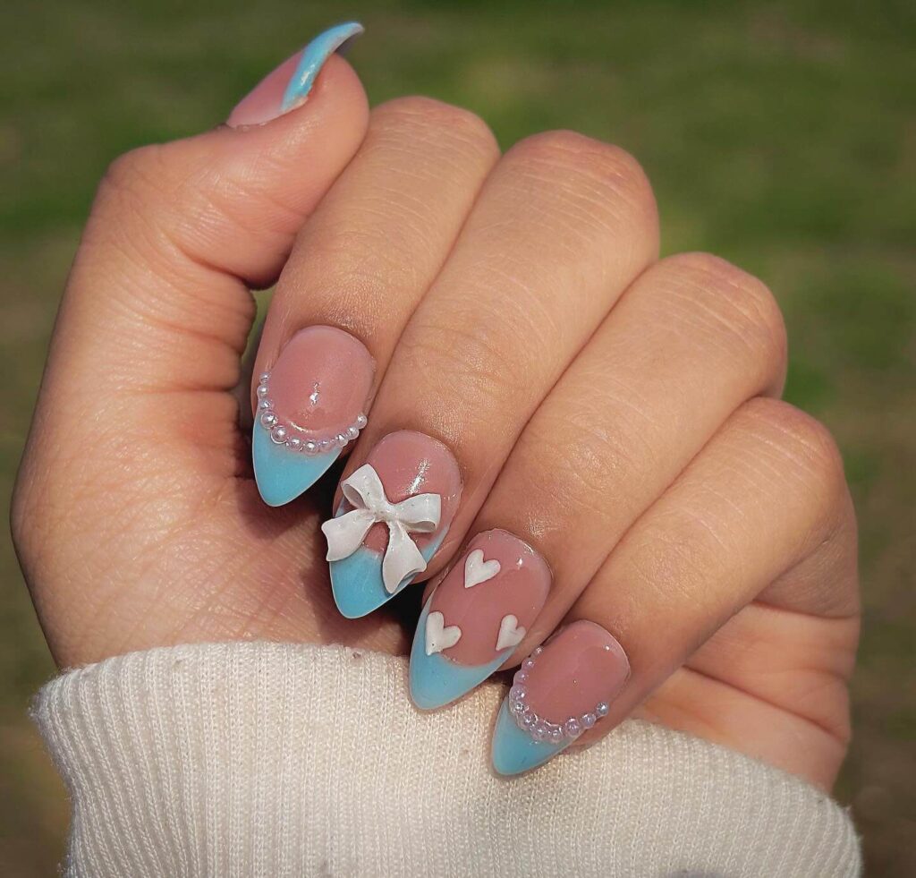 Stylish sky blue nails with a glossy finish, perfect for fresh and modern spring or holiday nail designs