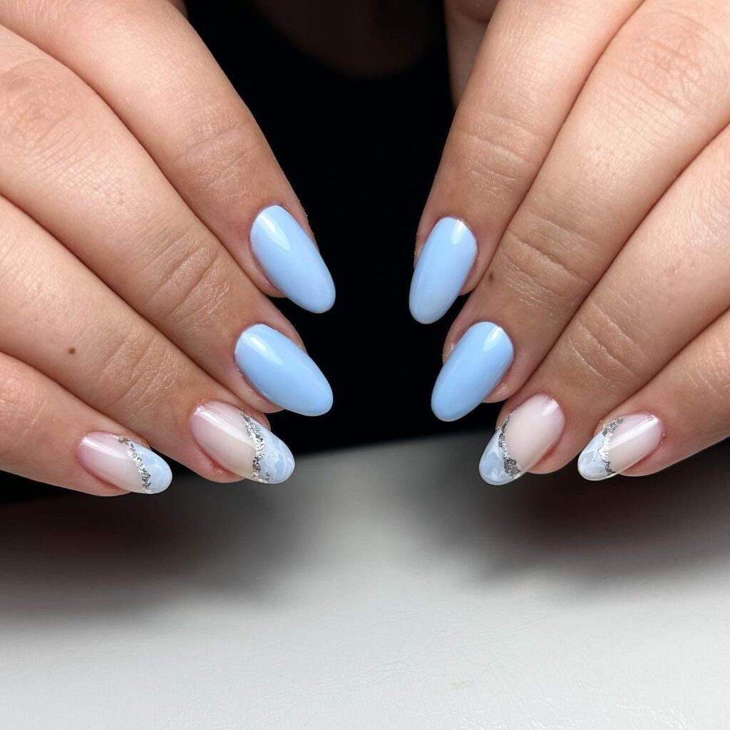 Stylish sky blue nails with a glossy finish, perfect for fresh and modern spring or holiday nail designs