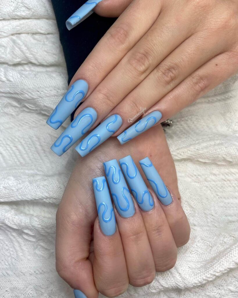 Stylish sky blue nails with a glossy finish, perfect for fresh and modern spring or holiday nail designs