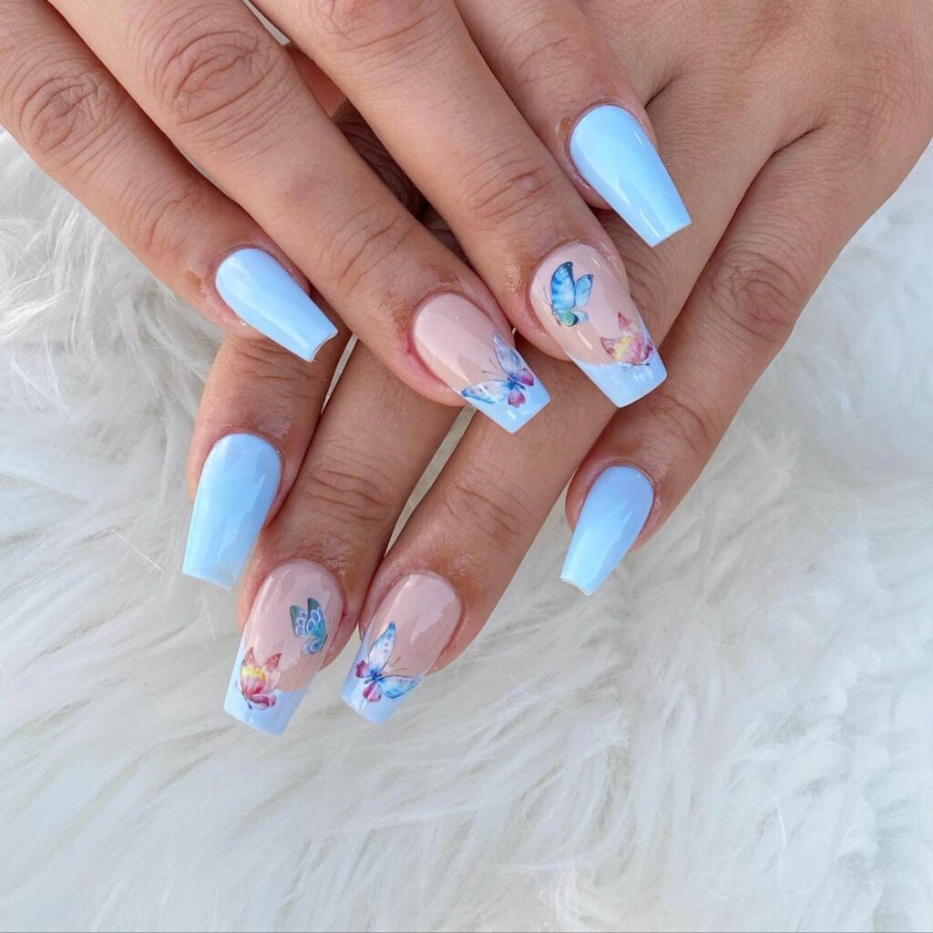 Stylish sky blue nails with a glossy finish, perfect for fresh and modern spring or holiday nail designs