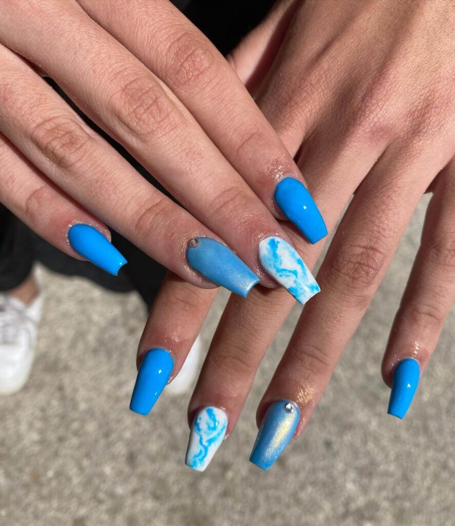 Stylish sky blue nails with a glossy finish, perfect for fresh and modern spring or holiday nail designs