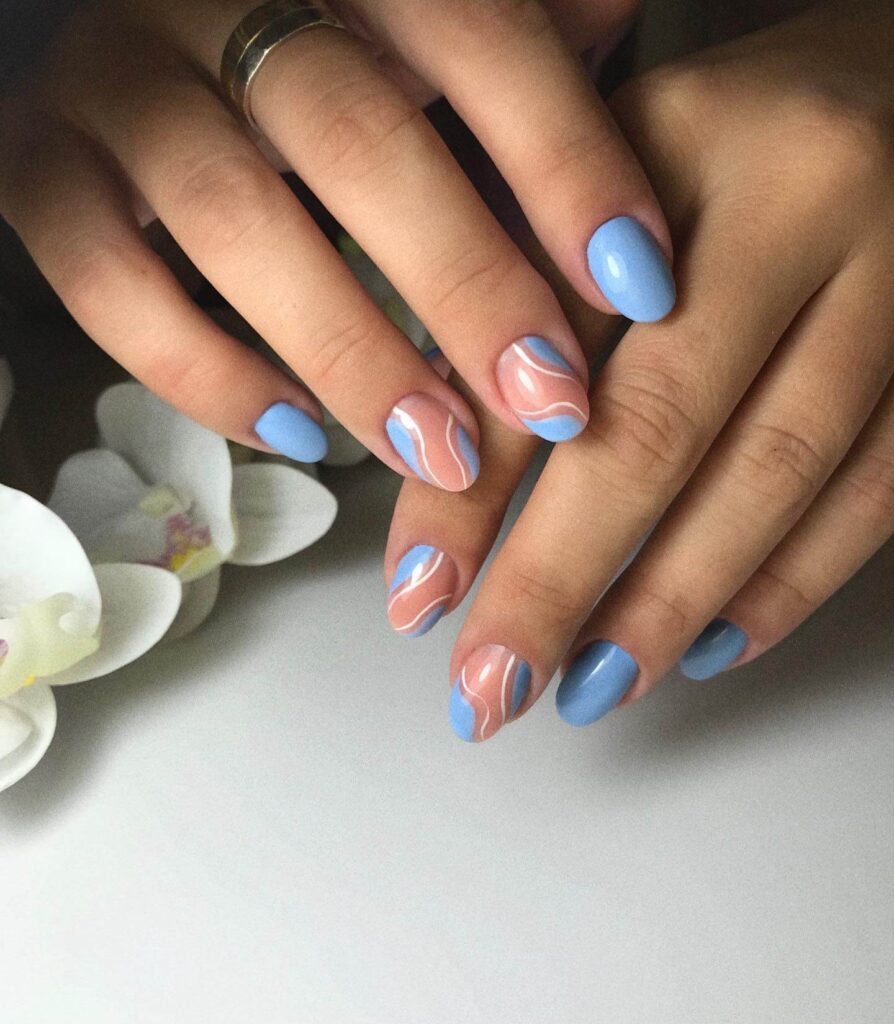 Stylish sky blue nails with a glossy finish, perfect for fresh and modern spring or holiday nail designs