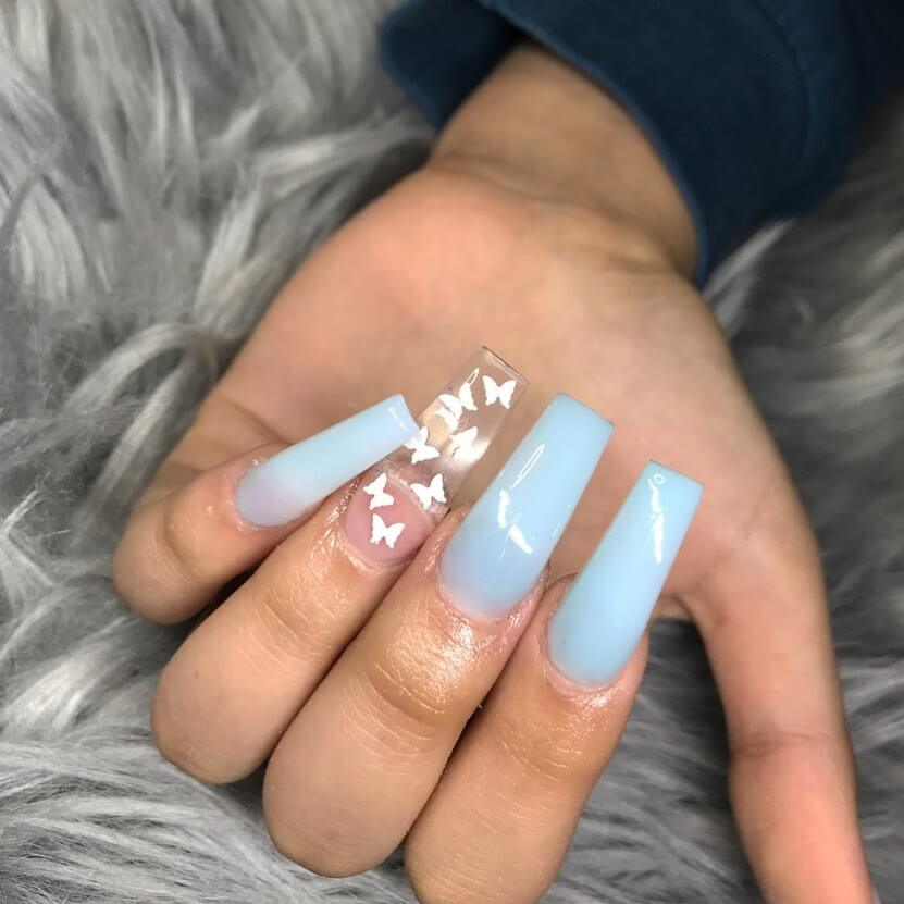 Stylish sky blue nails with a glossy finish, perfect for fresh and modern spring or holiday nail designs