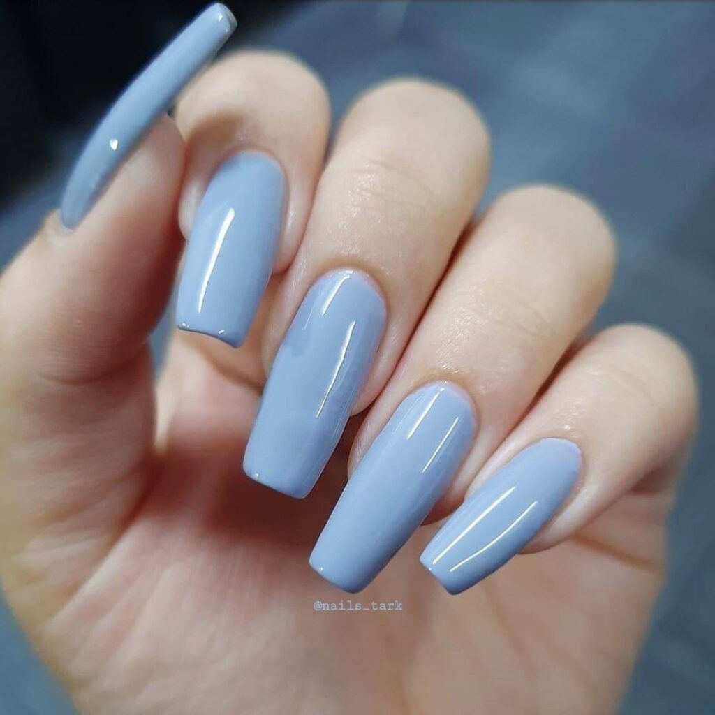 Stylish sky blue nails with a glossy finish, perfect for fresh and modern spring or holiday nail designs