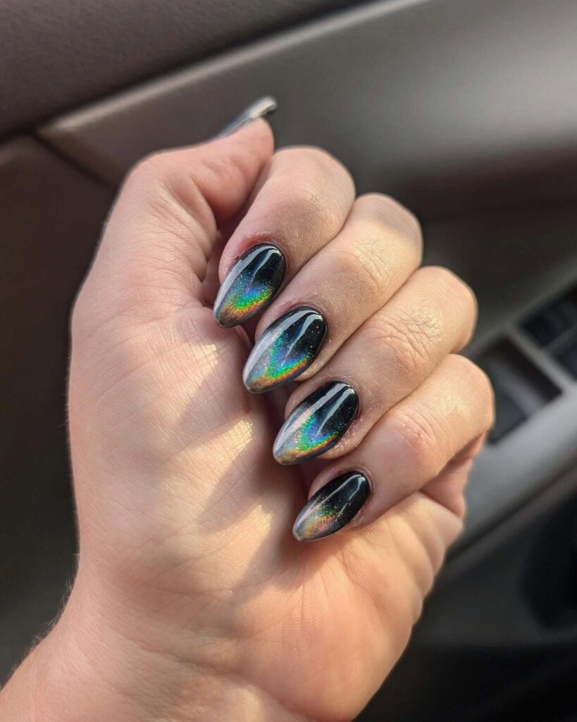 Holographic nails with chrome effects, featuring high-shine pigment and trendy mirror-like finishes for a futuristic look