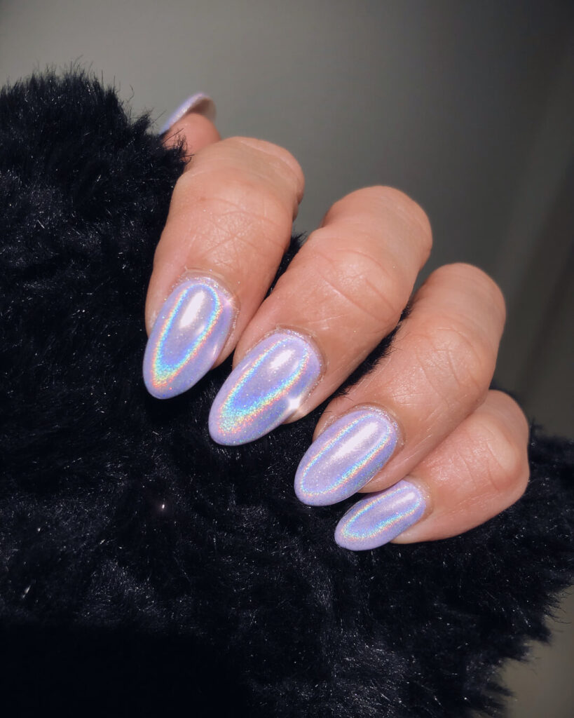 Holographic nails with chrome effects, featuring high-shine pigment and trendy mirror-like finishes for a futuristic look