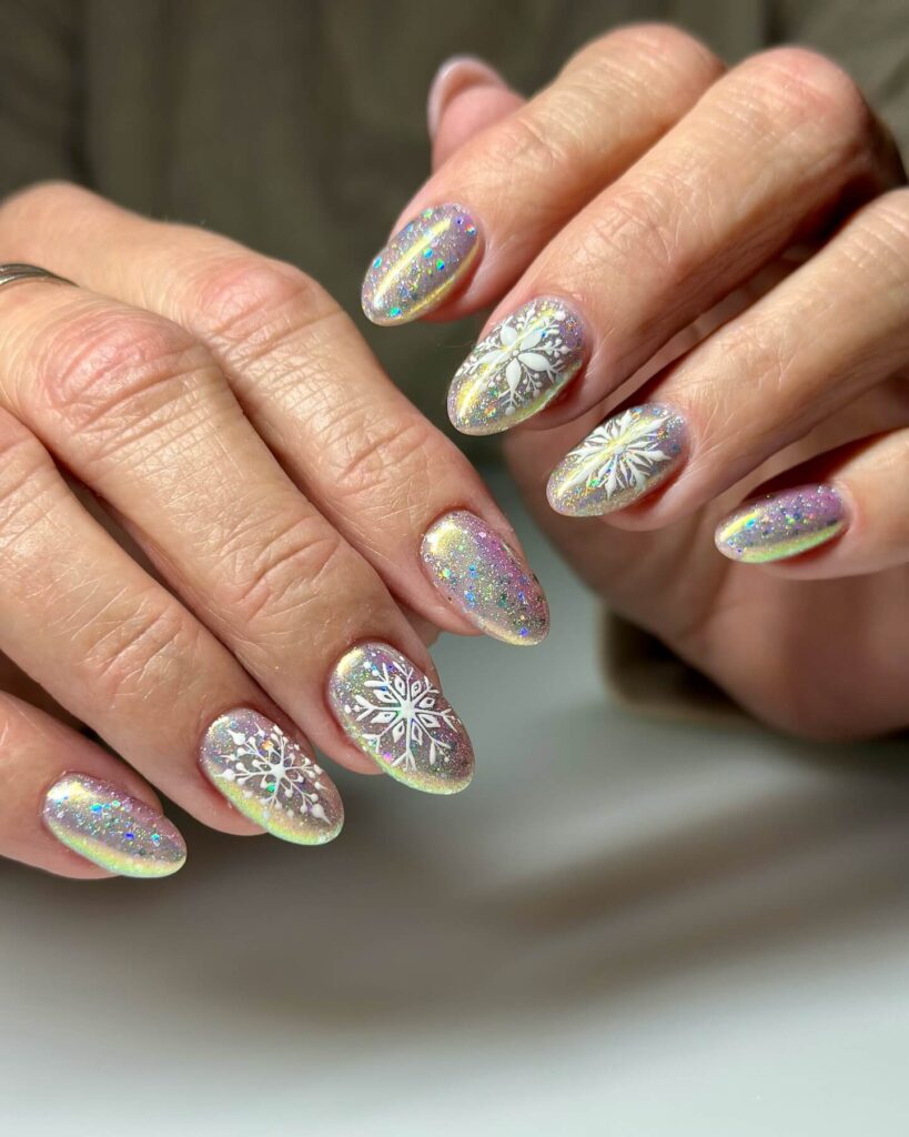 Holographic nails with chrome effects, featuring high-shine pigment and trendy mirror-like finishes for a futuristic look