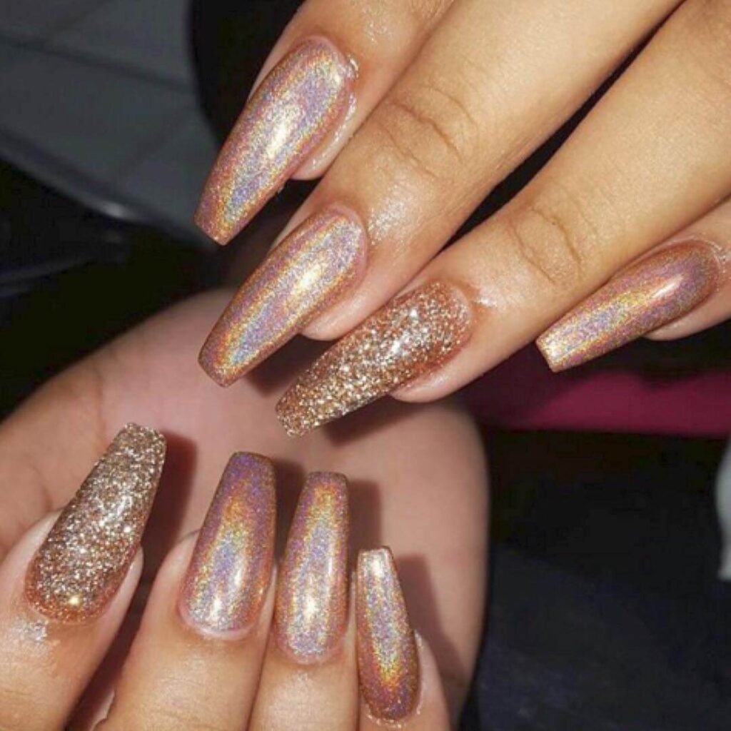 Holographic nails with chrome effects, featuring high-shine pigment and trendy mirror-like finishes for a futuristic look