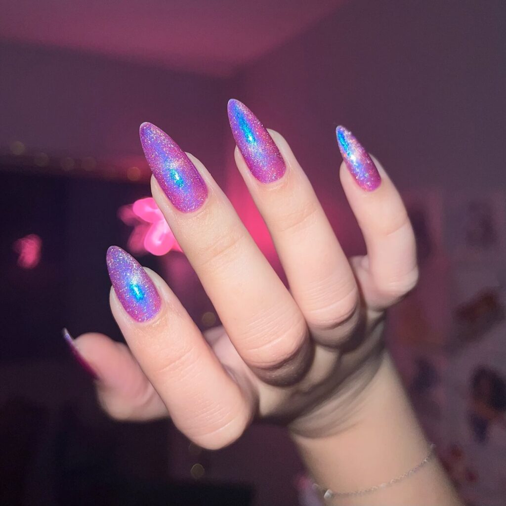 Holographic nails with chrome effects, featuring high-shine pigment and trendy mirror-like finishes for a futuristic look