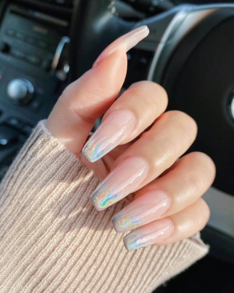 Holographic nails with chrome effects, featuring high-shine pigment and trendy mirror-like finishes for a futuristic look