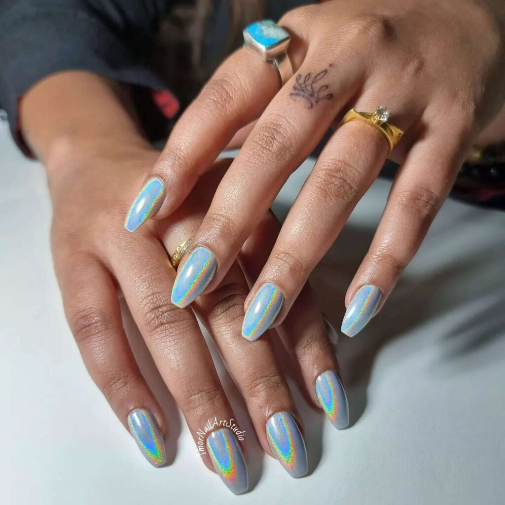 Holographic nails with chrome effects, featuring high-shine pigment and trendy mirror-like finishes for a futuristic look