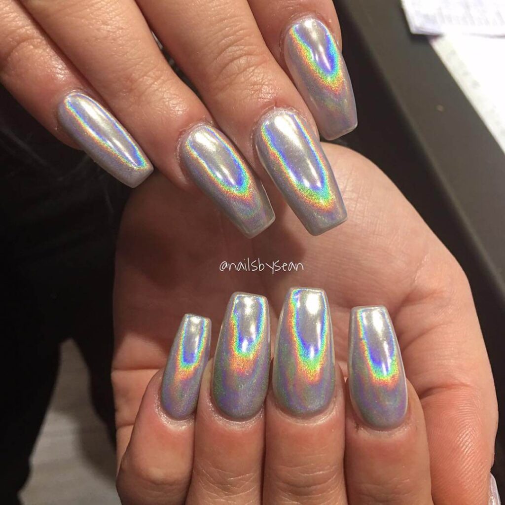 Holographic nails with chrome effects, featuring high-shine pigment and trendy mirror-like finishes for a futuristic look