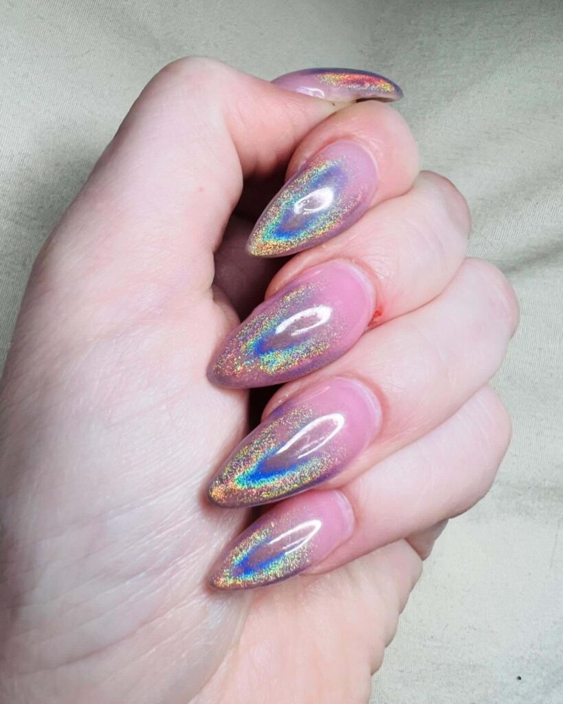 Holographic nails with chrome effects, featuring high-shine pigment and trendy mirror-like finishes for a futuristic look