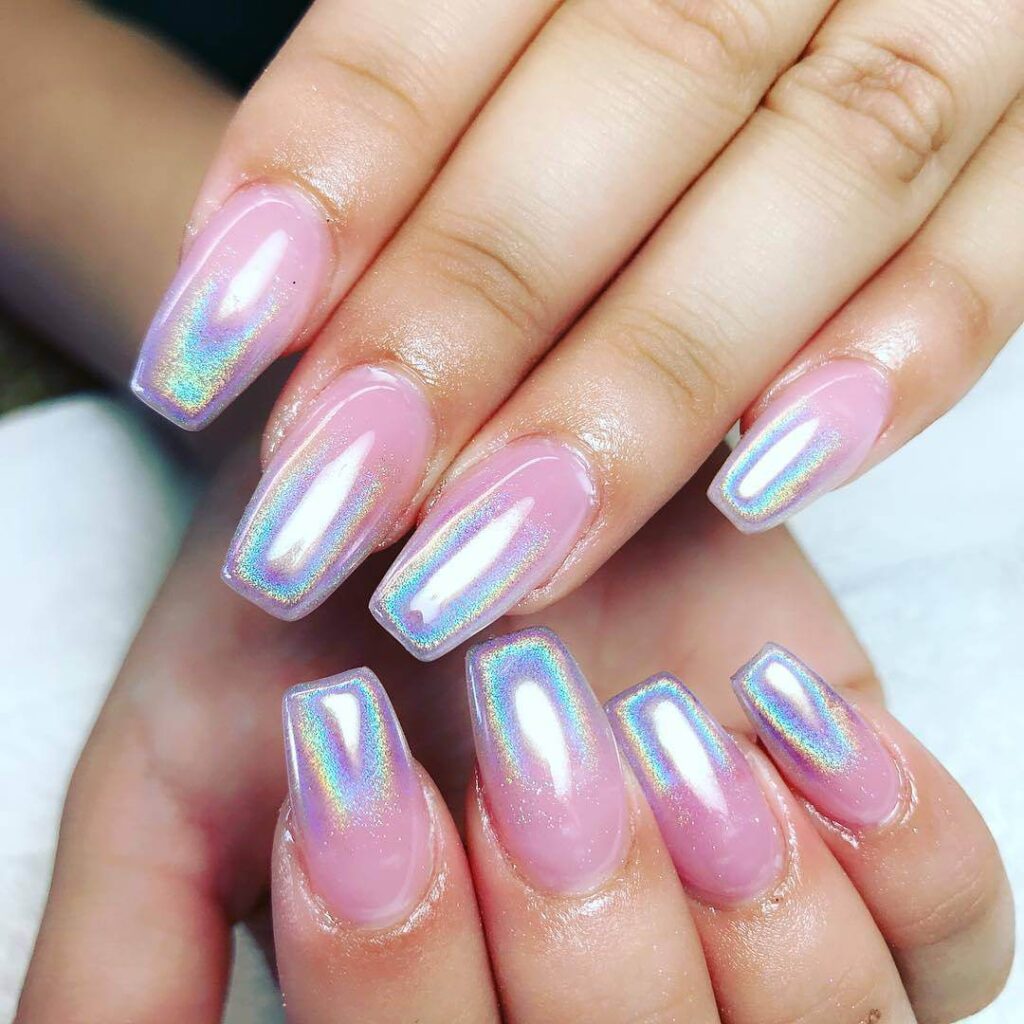 Holographic nails with chrome effects, featuring high-shine pigment and trendy mirror-like finishes for a futuristic look